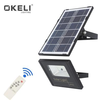 China High Brightness 10W 30W 60W 100W IP65 LED Outdoor Solar Garden Flood Light OKELI with Solar Panels for sale