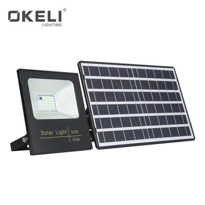 China Garden OKELI good quality 10w 30w 60w 100w IP65 smd waterproof outdoor led solar powered flood lamp for sale