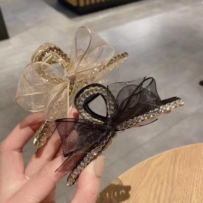 China Women Clips Soft Hair Accessories Wholesale Luxury Rhinestone Hair Claw Big Claw Clips Plastic Hair Claw Clips With Bow For Women for sale