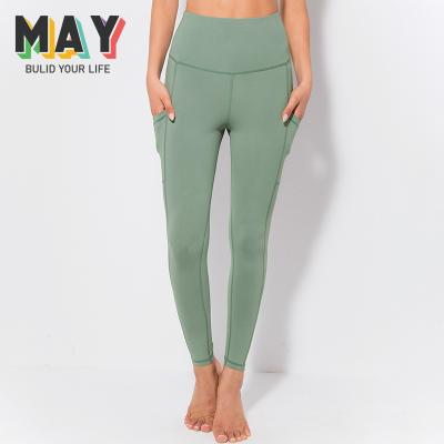 China New Breathable Nine-Part Yoga Pants For Women With Side Pockets Shaping Tight Slimming Leggings for sale