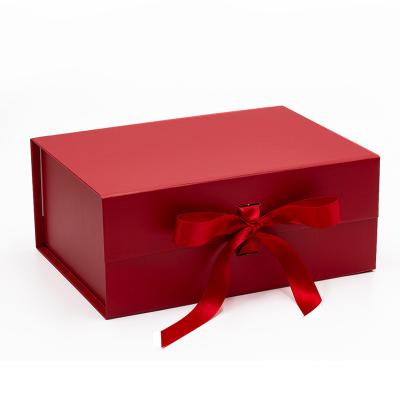 China Recycled Materials Matte Lamination Deep Red A5 Presentation Foldable Magnetic Gift Box With Ribbon for sale