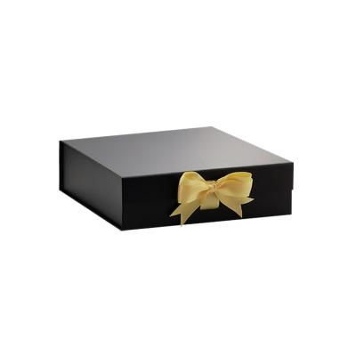 China Recycled Materials Bespoke Luxury Black Medium Magnetic Folding Rigid Gift Announcement Box With Custom Ribbon for sale