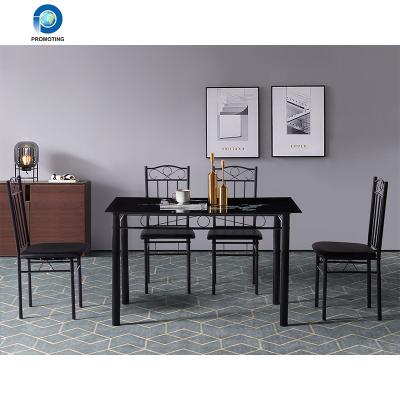 China Modern Design Hot Sale Dining Set Tempered Glass Top Dining Table Metal Frame And Convertible Diner Chair for sale