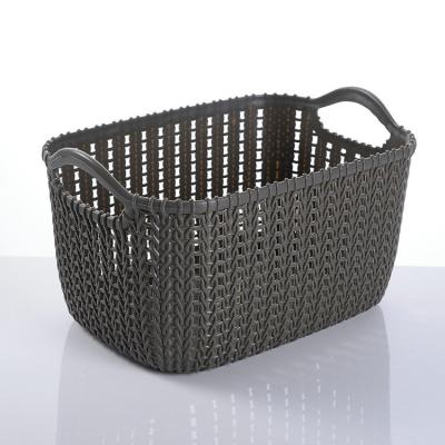 China No Kitchen Plastic Tabletop Cosmetics Sundries Double Handle Storage Basket Hollow Rattan Storage for sale