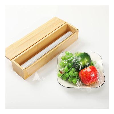 China QL1017 Aluminum and Plastic Wrap Organizer for Kitchen Plastic Wrap Dispenser Wood Wrap Dispenser with Cutter for sale