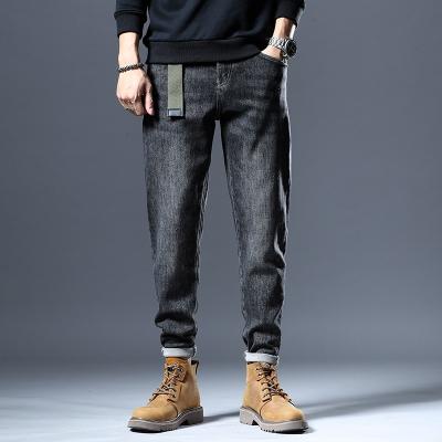 China 2021 men's character stretch jeans QUICK DRY autumn and winter new trend casual soft pants for sale