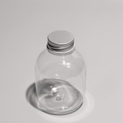 China Transparent PET Bottles with Screw On Aluminum Caps for sale