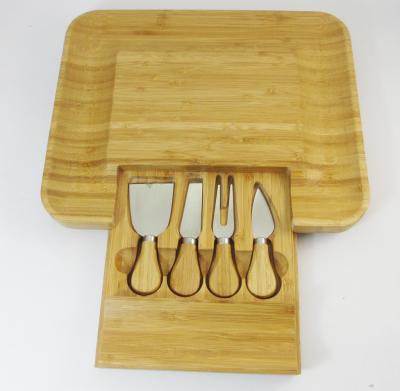 China 4PCS Bamboo Cheese Knife Set In Wooden Bamboo Slide-Out Drawer  Cutting Board for sale