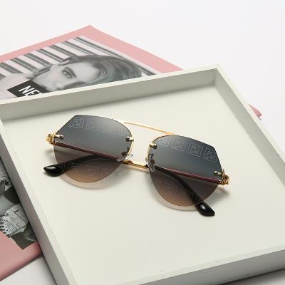 China Fashion Sunglasses Top Warm Sunglasses Color Frameless Metal Round Lens Women's Sunglasses for sale