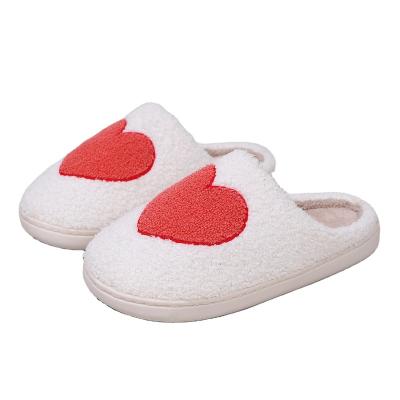 China Fashion Trend Autumn and winter indoor and outdoor casual warm plush slippers non-slip fashion big love pattern plush cotton slippers for sale