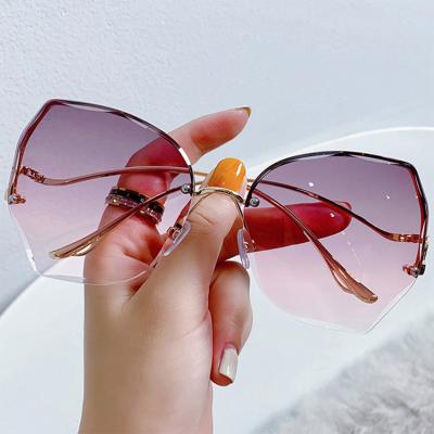 China Rimless Fashion Cut Rimless Sunglasses Brand Designer Ladies Irregular Eyewear Trend Metal Women Shade Sun Glasses UV400 for sale