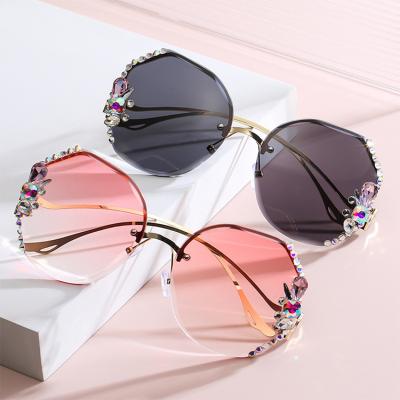 China 2022 Luxury Rimless Sunglasses Women Shades Glass UV400 Rhinestone Bling Big Frame Fashion Polygonal Ladies Glasses for sale