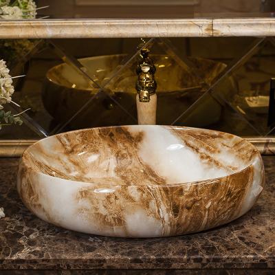 China Modern Design Pattern Countertop Oval Shape Modern Design Ceramic Marble Wash Hand Basin for sale