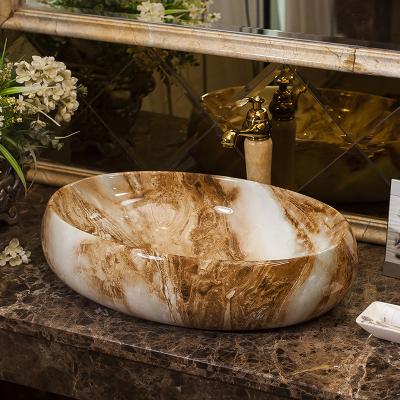 China Modern Hot Sale Ceramic Bathroom Sink Marble Pattern Oval Shape Ceramic Bathroom Sink for sale