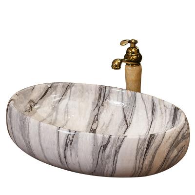 China Modern Design Lavatory Basin Bathroom Vessel Modern Italian Handmade Marble Oval Marble Ceramic Sink for sale