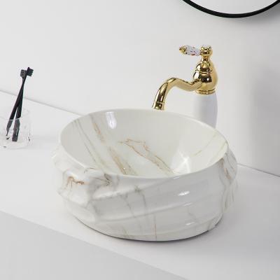 China Modern Unique Luxury Ceramic Marble Color Design Oval Shape Table Top Basin Basin Sink For Bathroom for sale