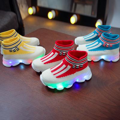 China Newest deodorization design knitted deodorization high top fly led bright running lights kids occasional slip on sneakers to bump sports shoes for sale