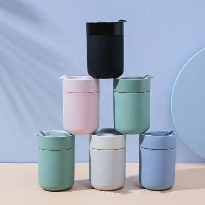 China Disposable Wholesale Custom Colored Ceramic Coffee Mug With Silicone Sleeve for sale