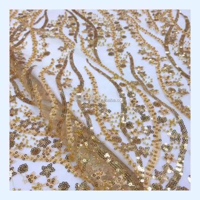 China Viable wholesale luxury gold shiny sequins beaded african ceremony lace embroidery fabric in stock for sale