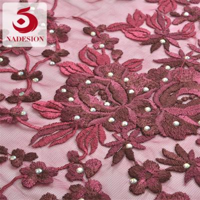 China Viable hot selling fancy embroidery design / design stone embroidery schiffli fancy fabrics for sale