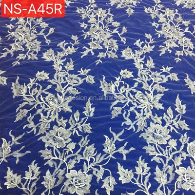 China Sustainable Luxurious Embroidery Beaded Ivory White Bridal Tulle Lace Fabric for sale