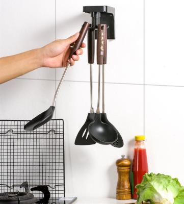 China Modern Kitchen Storage Hook Revolving Punch Free Wall Mounted Kitchenware One Spoon Knife Storage Rack Retractable Shelf for sale