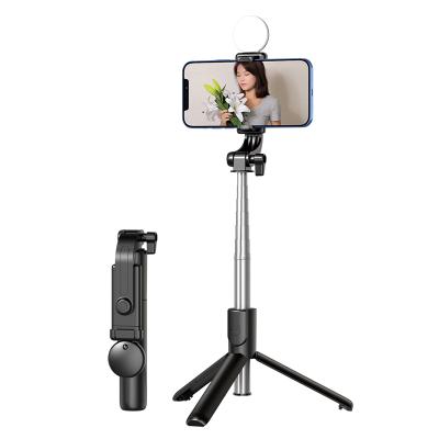 China Fold Selfie Stick Mobile Phone Holder Stand Tripod Integrated Telescopic Folding Selfie Portable Device for sale