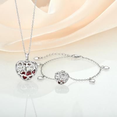 China Anti Tarnish Valentine Jewelry Set 925 Sterling Silver Heart Dance Movable Zircon Necklace Red Stone Pendant Bracelet for sale