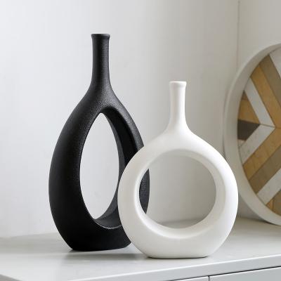 China Modern White And Black Ceramic Vase For Home Office Decor Cavity Interior Decorative Ceramic Flower Vase for sale