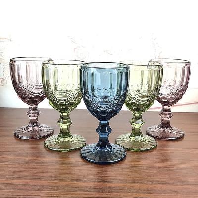 China Wholesale Embossed Stocked Embossed Cheap Novelty Decorative Colored Water Glass Heavy Base Wine Glass for Wedding and Party for sale