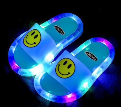 China Massage Children Kids Light Up Slippers LED Face Flower Instant Light Outdoor Luminescent Smile Slippers for sale