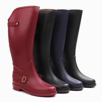 China Fashion Trend Manufacturer Women PVC Knee High Plastic Riding Boots Wellington Boots Upper Waterproof Rubber Boots With Buckle for sale