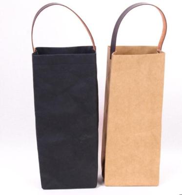 China Custom Made Luxury Eco-Friendly Household Logo Wine Kraft Paper Bag Red Wine Washable Gift Bag With Leather Handle for sale