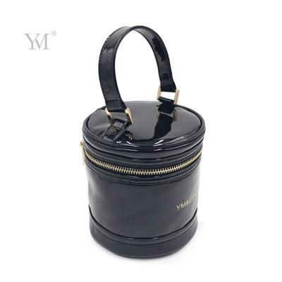 China NATIONAL Black Makeup Bag Promotional Patent Leather Cosmetic Bag With Logo And Gold Handle for sale