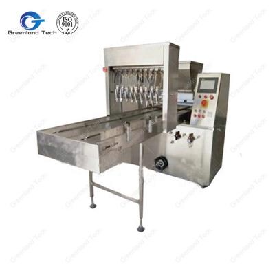 China Snack Factory Design GT-300S Latest Cookie Cake Tray Oil Spraying Machine 5-8 Trays/Min for sale