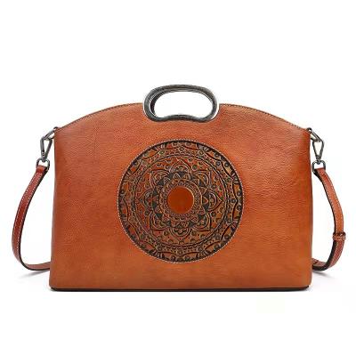 China Fashion\comfortable new vintage embossed genuine leather bag\goods 2022 totem cowhide top layer bag cross-body ladies handbag totem for sale