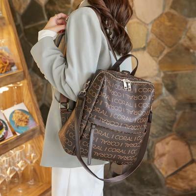 China 2022 Popular Fashion Waterproof Casual Ladies Backpack Vintage Printing Large Capacity Travel Bag for sale