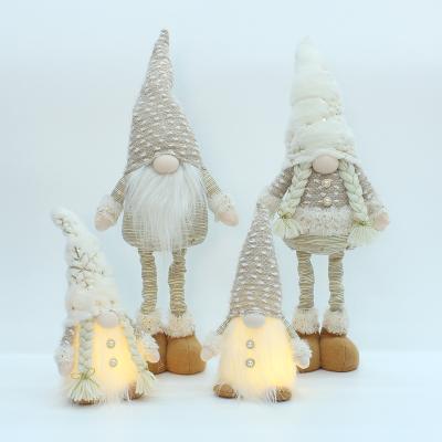 China Christmas Decorations Wholesale Price Cloth Snowman Saint Window Table Decoration Christmas Doll Leg Retractable Figures for sale