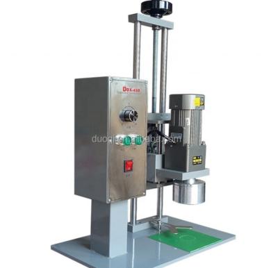 China 110V DDX-450 Línea de procesamiento Manual Máquina de tapón para botellas de vidrio de cristal de agua, champú de perfume de plástico en venta