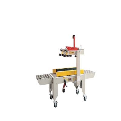 China 60 mm FXJ-5050 kartonverzegelmachine roestvrij automatische doos verpakkingsmachine Te koop