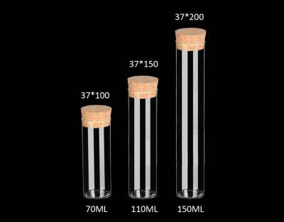 中国 30mmの競争価格ガラスは貯蔵または装飾のためのコルクのふたが付いているびんを、震動させます 販売のため
