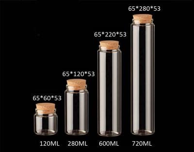 中国 65mmの卸し売り空ガラスはコルクのふたが付いているびんを、メッセージのために、結婚の願い、DIYのプロジェクト、装飾震動させます 販売のため