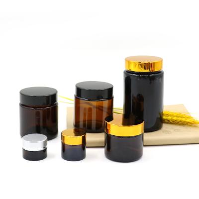 China High Qiality Manufacturers Wholesale Brown Glass Jars Amber Cream Bottle With Black Lid for sale