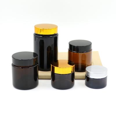 China Qiality Amber Glass Jar With Screw High Cap Frosted Cream Glass Jar With Gold Silver Black Aluminum Cap for sale