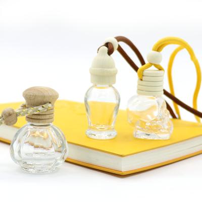 China High Qiality Empty Glass Car Air Freshener Perfume Bottle Perfume Bottle Hanging Diffuser Bottle With Wooden Cap for sale