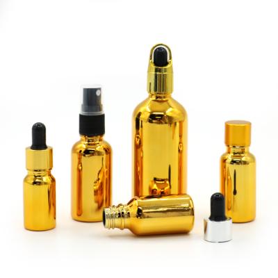 China High Qiality Plated Gold Oil Bottle 20ml 30ml 50ml Gold Small Glass Essential Bottle Cosmetics Bottle for sale