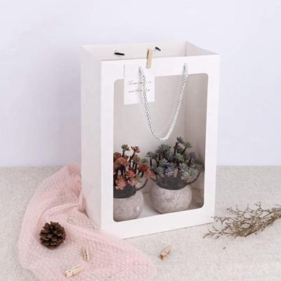 China Creative Recyclable Bouquet Handbag Bouquet Packaging Bag Large Gift Paper Bag With Window for sale