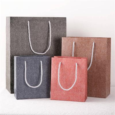 China Unique design hot sale flat bottom snow gift craft friendly/foldable/customized shopping fancy paper bag for sale