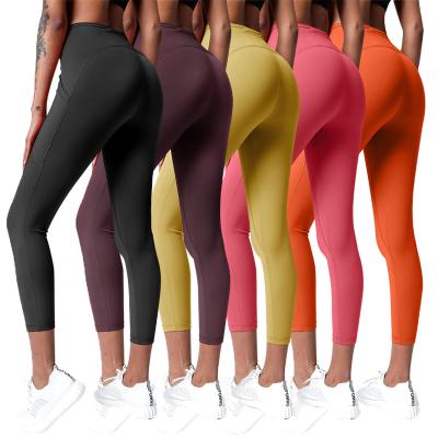 China Breathable Yoga Gaiters With Pockets Pants Workout Running High Waist Women Yoga Pants Gaiters for sale