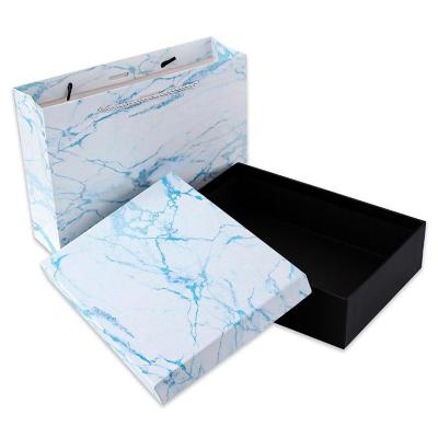 China Recyclable Rigid Women's Clothing Treasure Clamshell Mini Suitcase Custom Flip Closure Textured Paper Box Packaging Box With Ribbon for sale